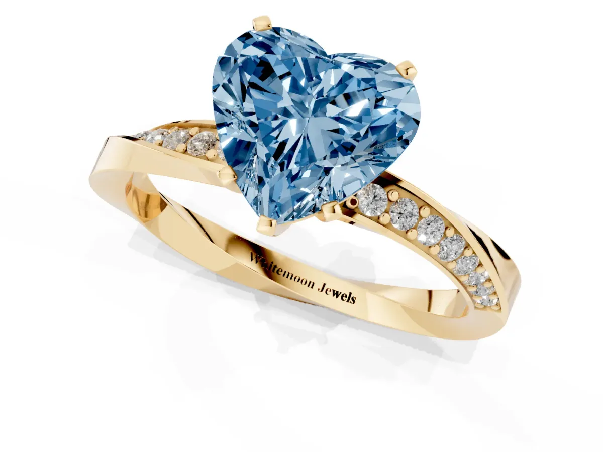 Fancy Blue Heart Cut Diamond Engagement Ring with Side Stone Accents and Four-Prong Setting Yellow gold