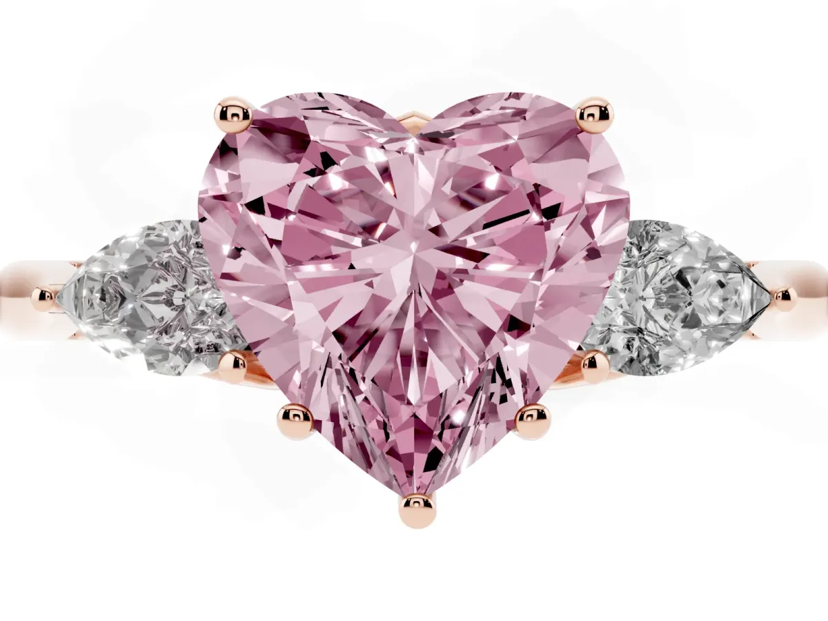 Fancy Pink Three-Stone Heart Cut Diamond Ring with Pear Side Stones in Four-Prong Setting Rose gold