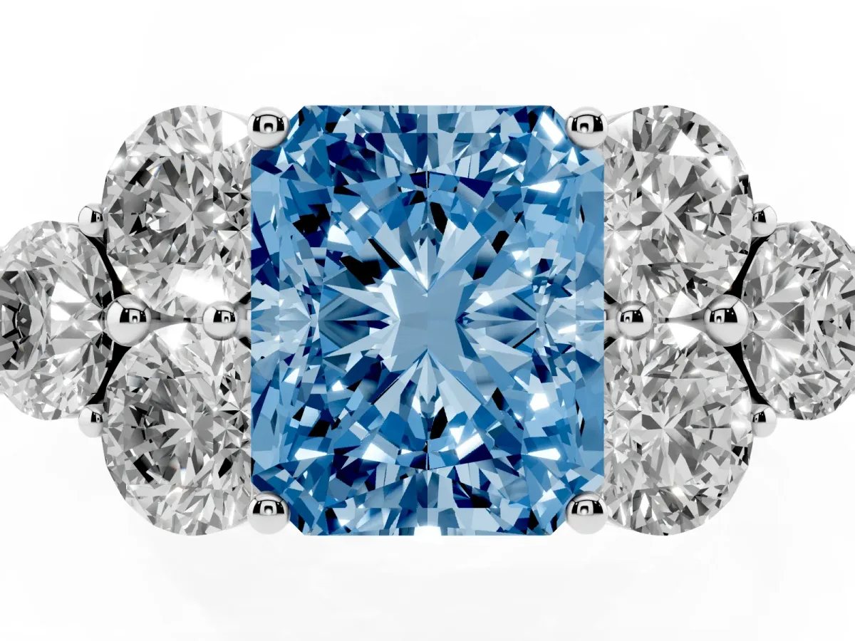 Fancy Blue Radiant Cut Cut Diamond Cluster Ring with Round Accent Stones and Prong Setting on a Classic Band White gold