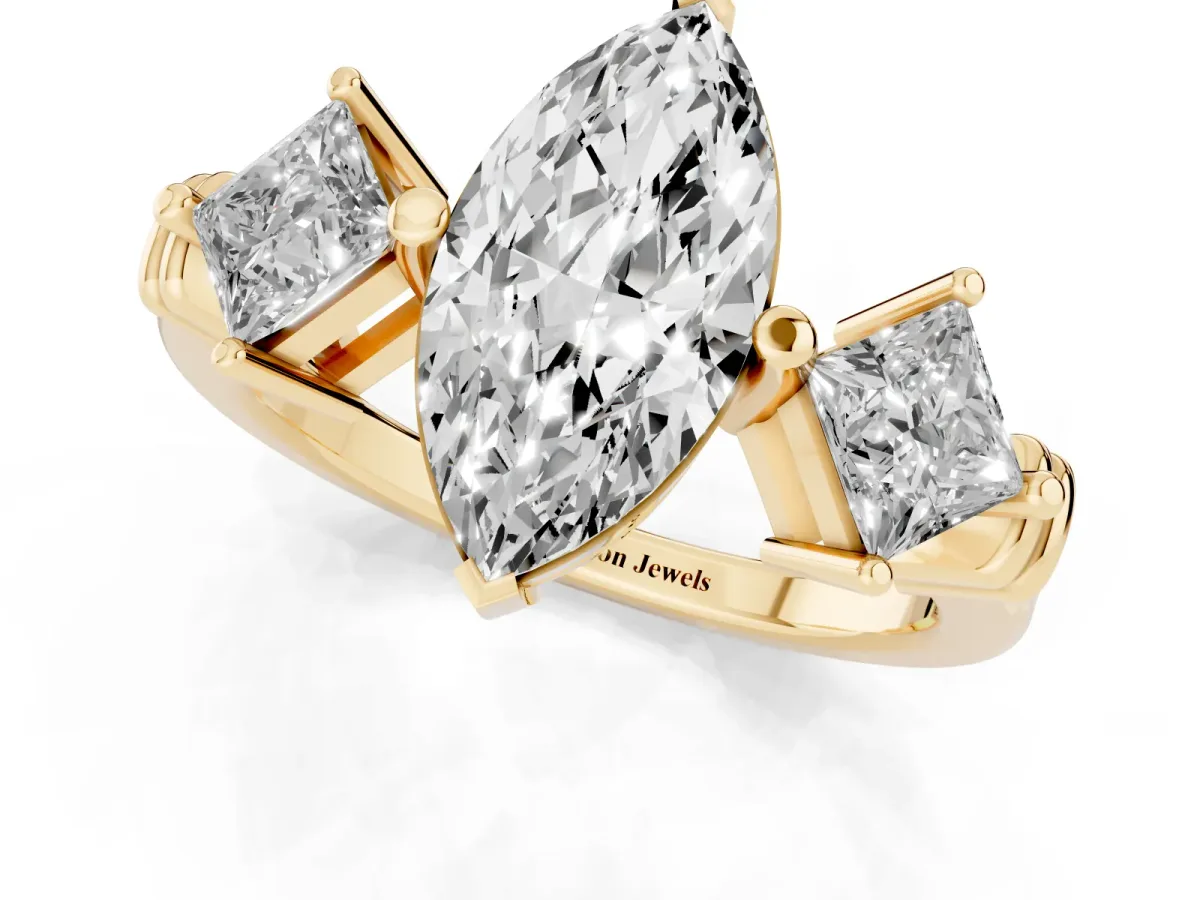 Three-Stone Marquise Cut and Princess Cut Diamond Ring with Channel Band and Four-Prong Setting Yellow gold