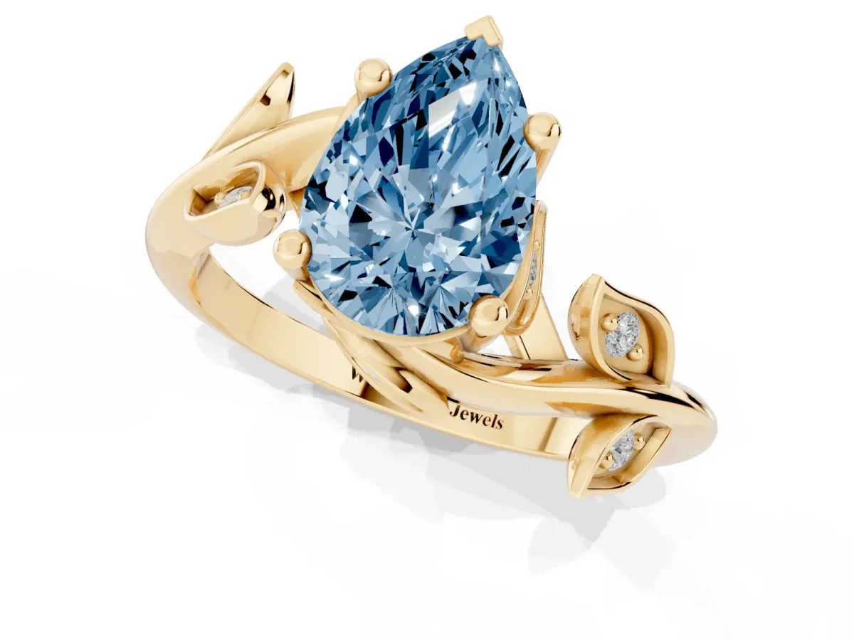 Fancy Blue Pear Cut Solitaire Twist Engagement Ring with Leaf Accents and Prong Setting Yellow gold
