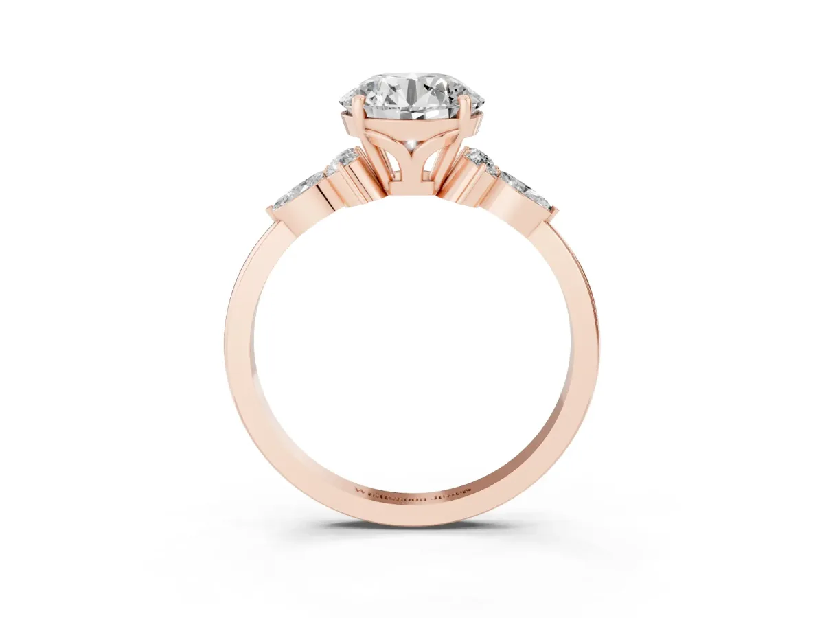 Round Cut Brilliant Diamond Solitaire Ring with Pear Side Stones and Four-Prong Setting Rose gold