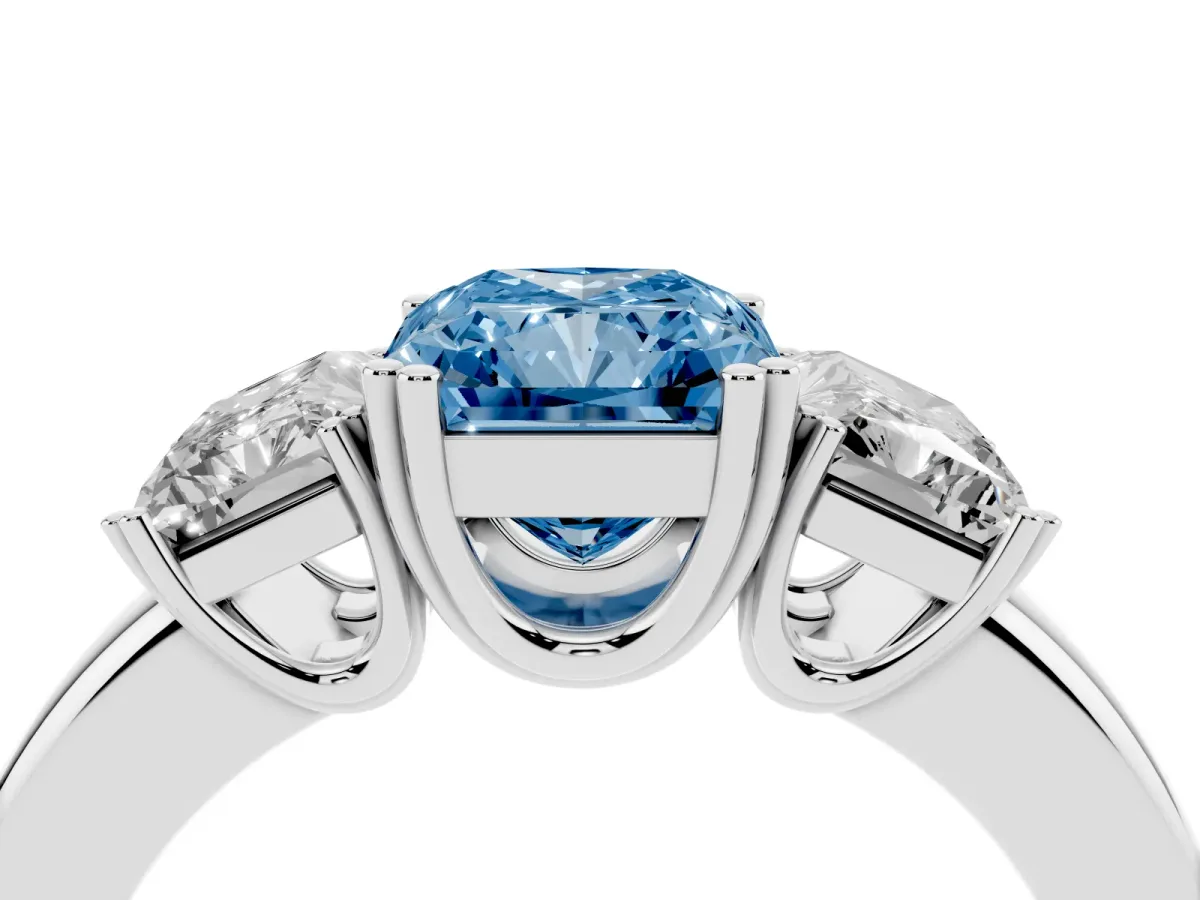 Fancy Blue Three-Stone Radiant Cut Cut Diamond Ring with Channel Set Band and Four-Prong Setting Silver