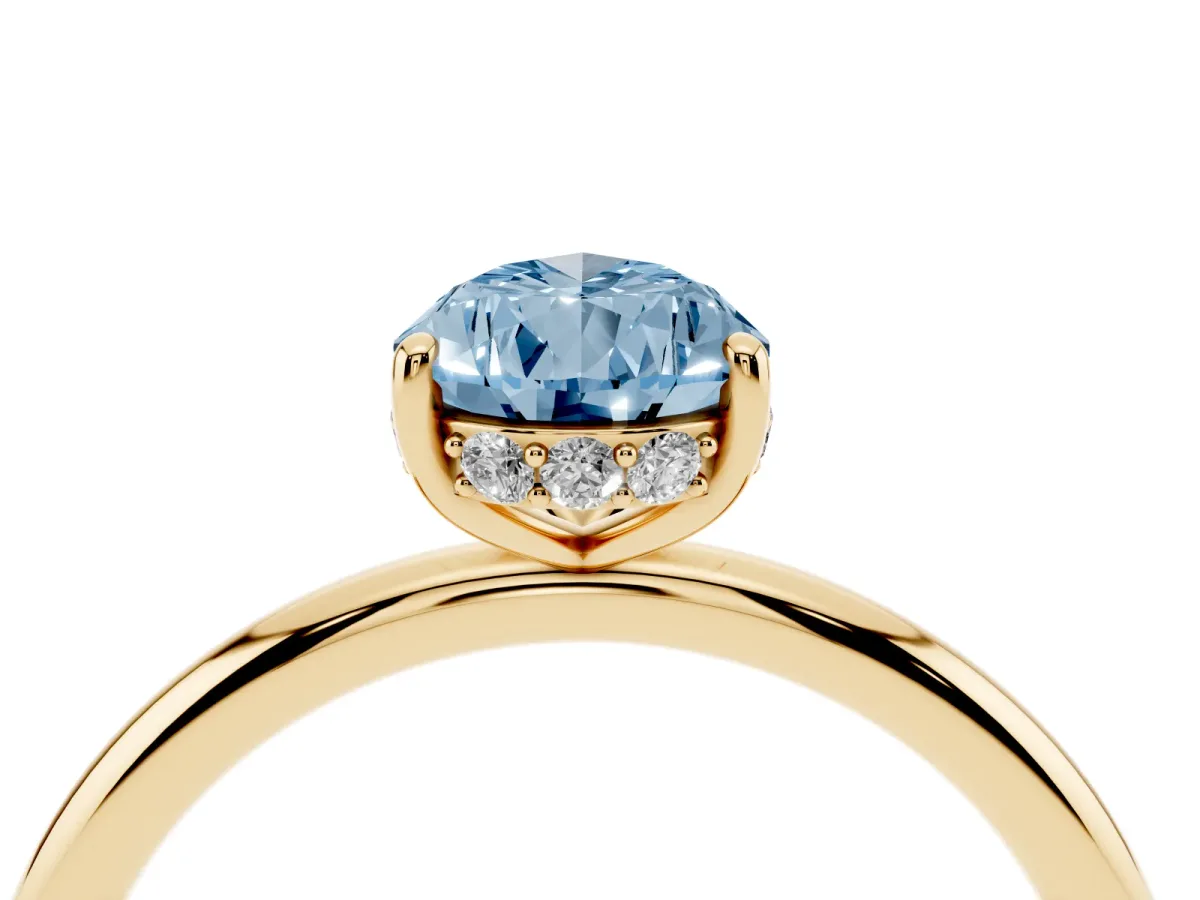 Fancy Blue Pear Cut Solitaire Diamond Ring with a Classic Band and Four-Prong Setting Yellow gold