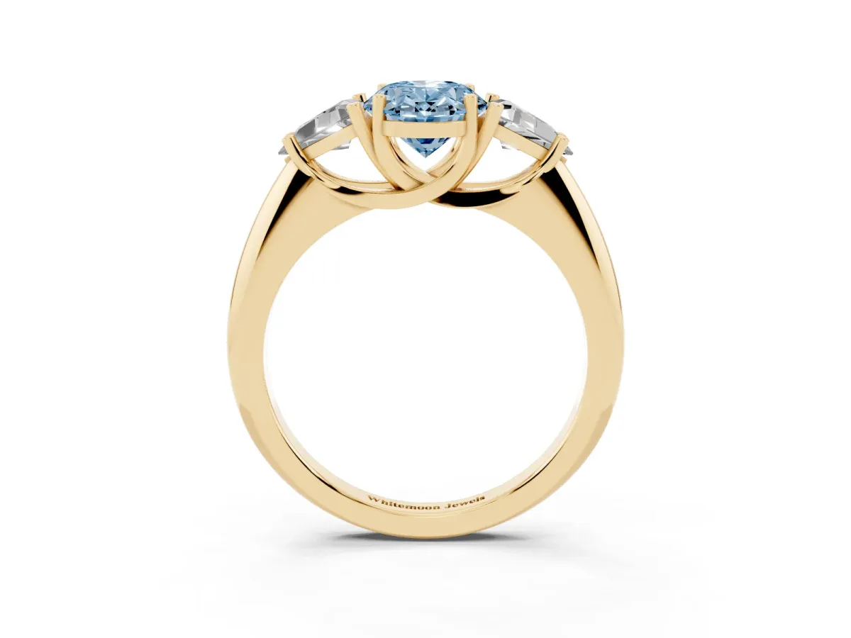 Fancy Blue Three-Stone Oval Cut Diamond Engagement Ring with Trillion Side Stones and Prong Setting Yellow gold