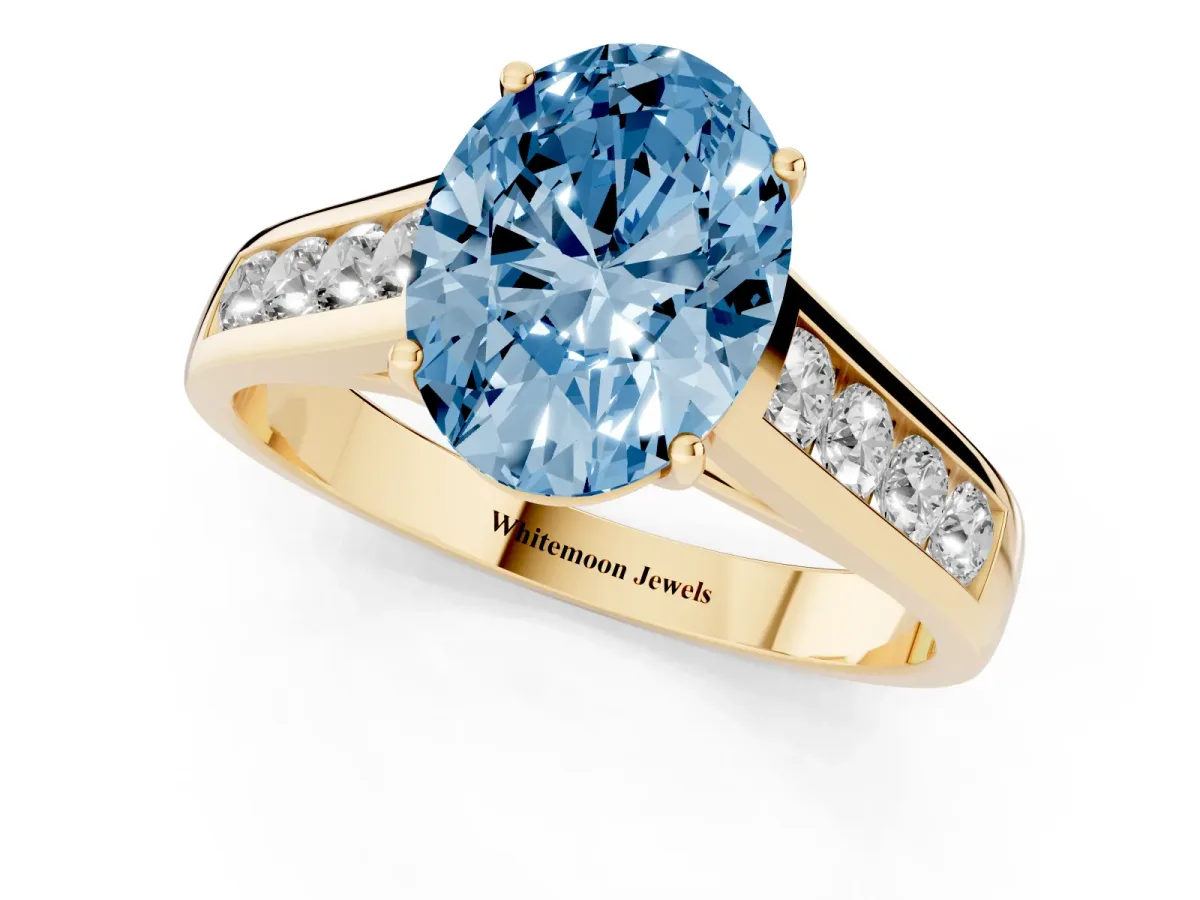 Fancy Blue Oval Cut Brilliant Channel-Set Solitaire Ring with Four-Prong Setting Yellow gold