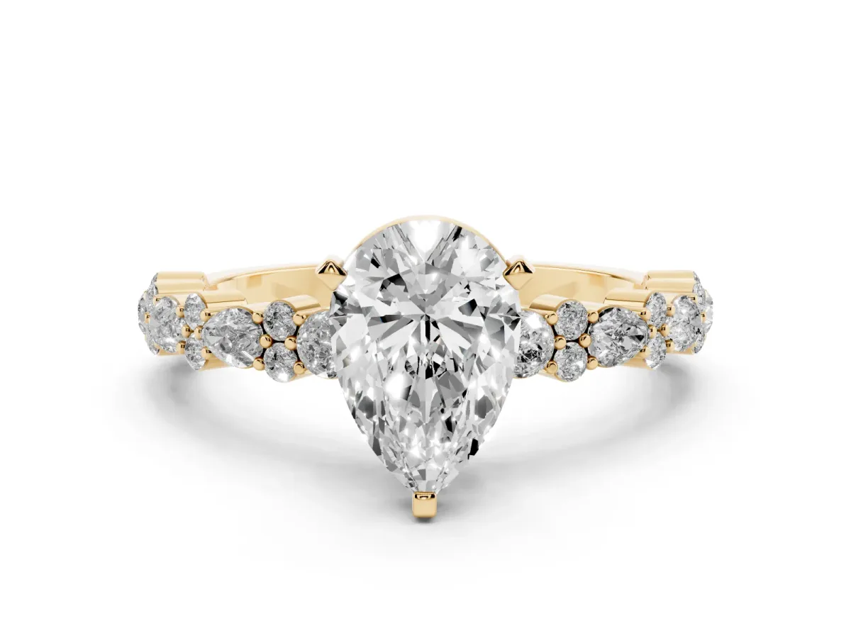 Pear Cut Diamond Side Stone Solitaire Ring with Round and Four-Prong Setting Yellow gold