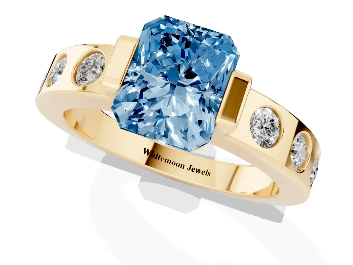 Fancy Blue Radiant Cut Brilliant Channel-Set Diamond Ring with Bezel Prong Setting Yellow gold