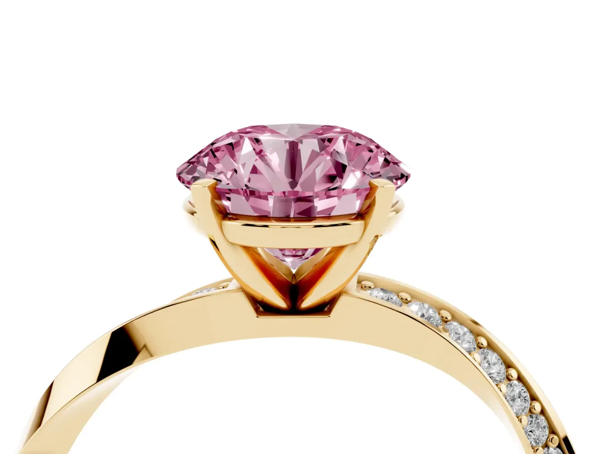 Fancy Pink Round Cut Diamond Engagement Ring with Side Stone Accents and Four-Prong Setting Yellow gold