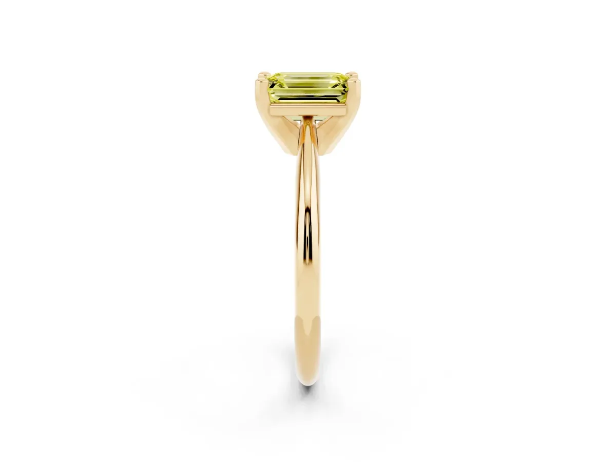 Fancy Yellow Emerald Cut Cut Solitaire Ring with Four-Prong Setting on a Classic Band Yellow gold