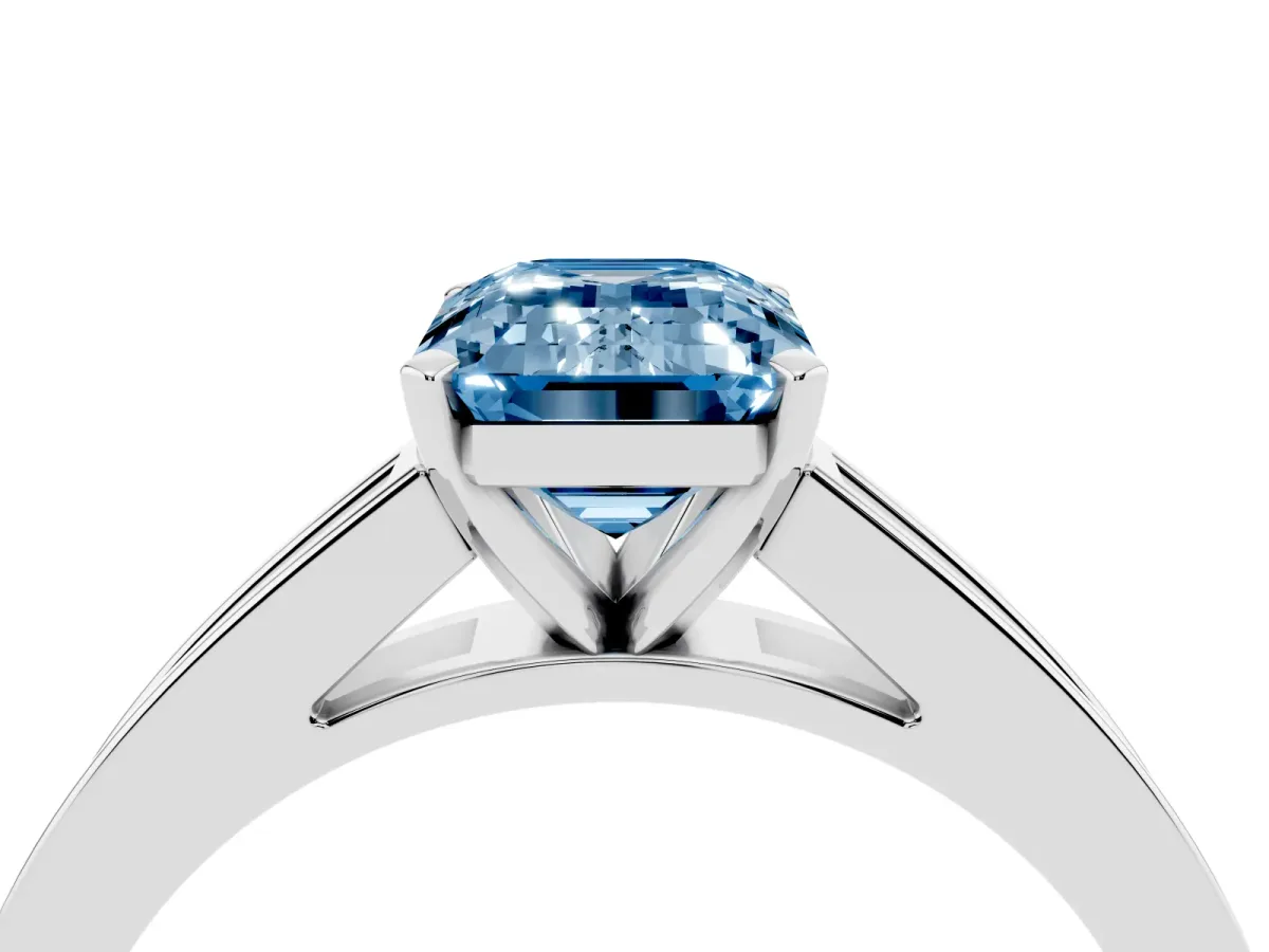 Fancy Blue Emerald Cut Solitaire Diamond Ring with Channel-Set Band and Four-Prong Setting Silver