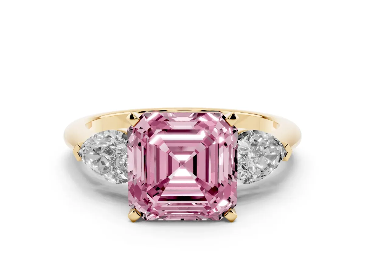 Fancy Pink Three-Stone Asscher Cut Diamond Ring with Pear Side Stones and Four-Prong Setting Yellow gold