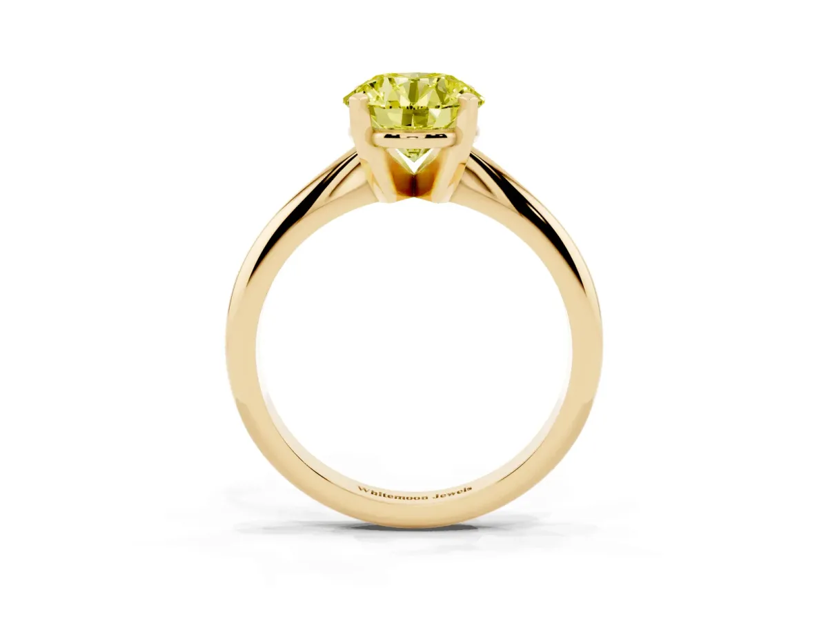 Fancy Yellow Round Cut Cut Solitaire Ring with Four-Prong Setting on a Classic Band Yellow gold