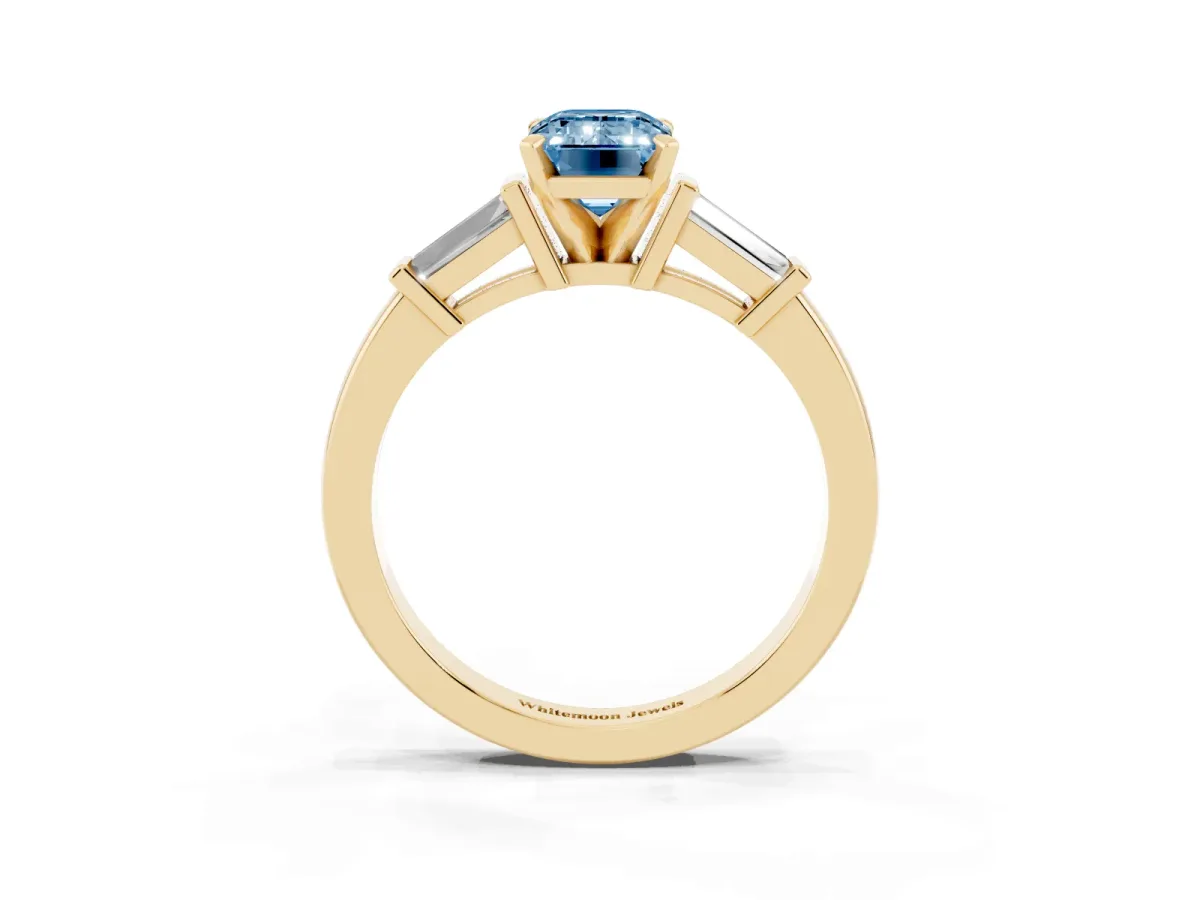 Fancy Blue Emerald Cut Cut Diamond Solitaire Ring with Tapered Baguette Accents and Four-Prong Setting Yellow gold