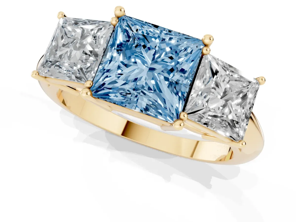 Fancy Blue Three-Stone Princess Cut Cut Diamond Engagement Ring with Prong Setting on a White Gold Band Yellow gold