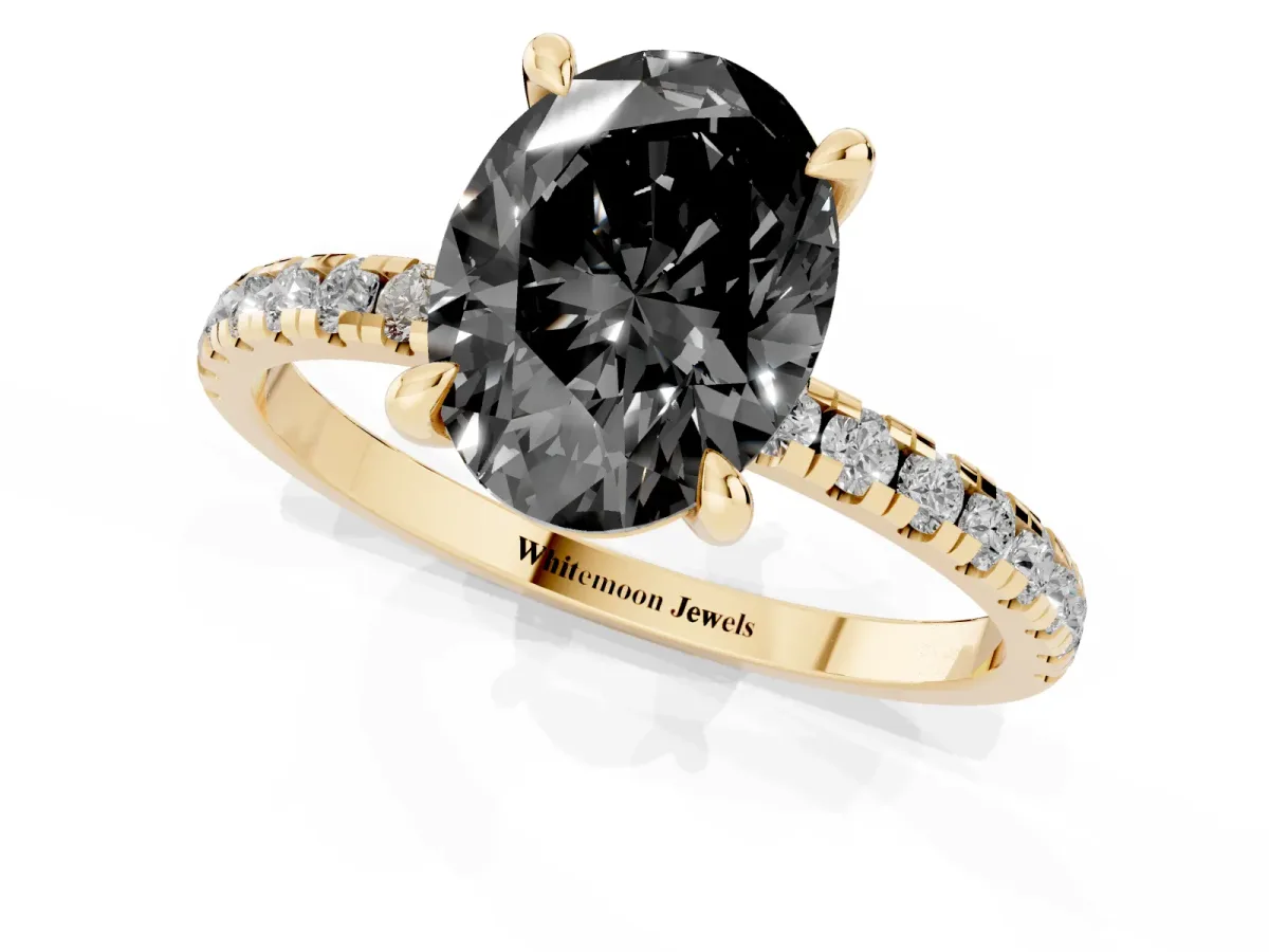 Fancy Black Oval Cut Diamond Brilliant Solitaire Ring with Pavé Band and Four-Prong Setting Yellow gold