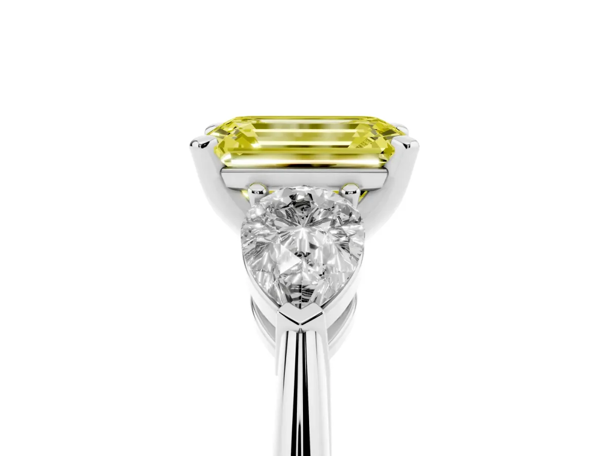 Fancy Yellow Three-Stone Emerald Cut Diamond Ring with Pear Side Stones and Four-Prong Setting Silver