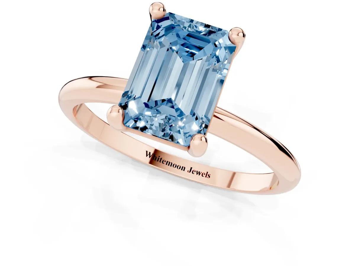 Fancy Blue Emerald Cut Solitaire Diamond Ring with 4-Prong Setting on a Classic Band Rose gold
