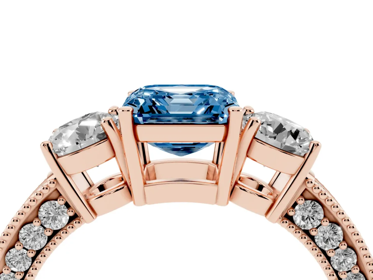 Fancy Blue Asscher Cut Three-Stone Diamond Ring with Pavé Band and Four-Prong Setting Rose gold