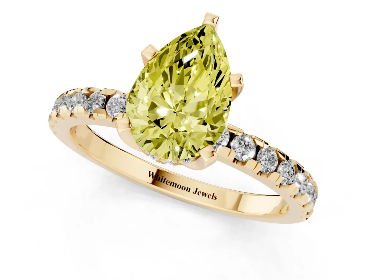 Fancy Yellow Pear Cut Diamond Solitaire Ring with Round Pavé Band and Four-Prong Setting Yellow gold