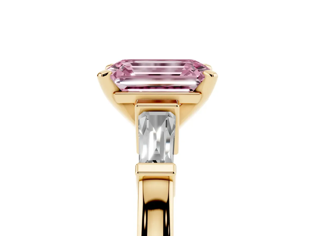 Fancy Pink Emerald Cut Cut Diamond Solitaire Ring with Tapered Baguette Accents and Four-Prong Setting Yellow gold