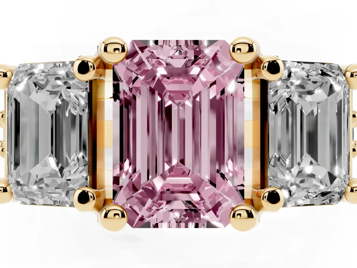 Fancy Pink Emerald Cut Diamond Three-Stone Ring with Channel Set Band and Four-Prong Setting Yellow gold