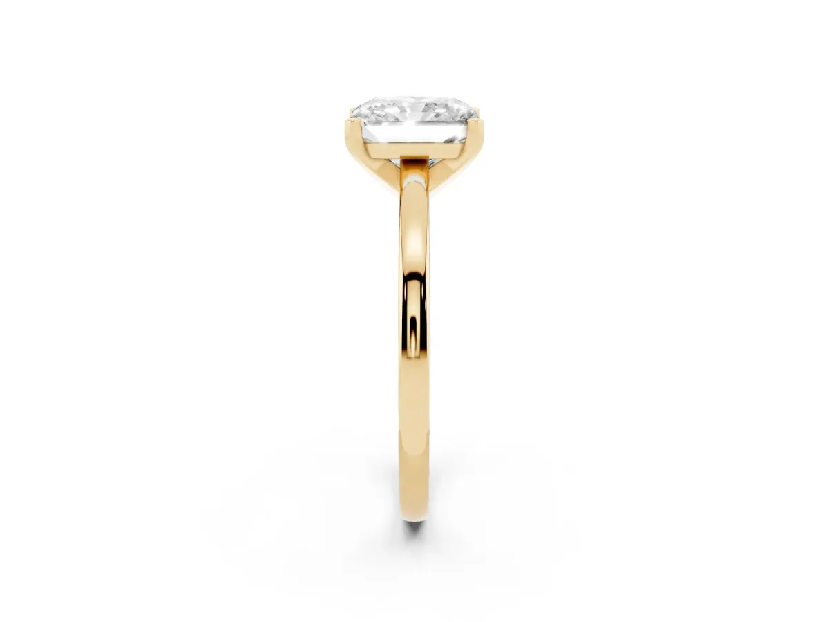 Radiant Cut Solitaire Diamond Engagement Ring with Four-Prong Setting on a Classic Band Yellow gold