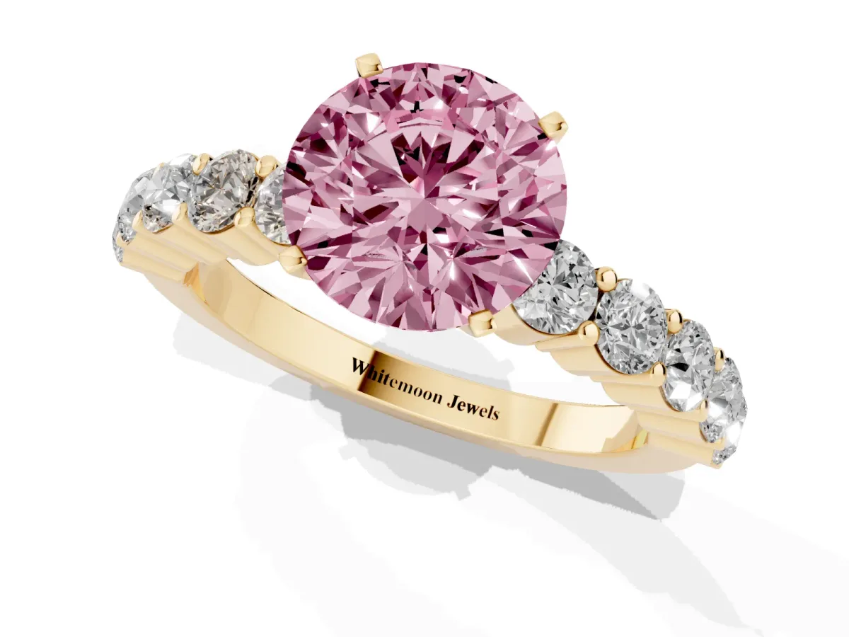 Fancy Pink Round Cut Diamond Solitaire Ring with Shared Prong Round Side Stones Yellow gold