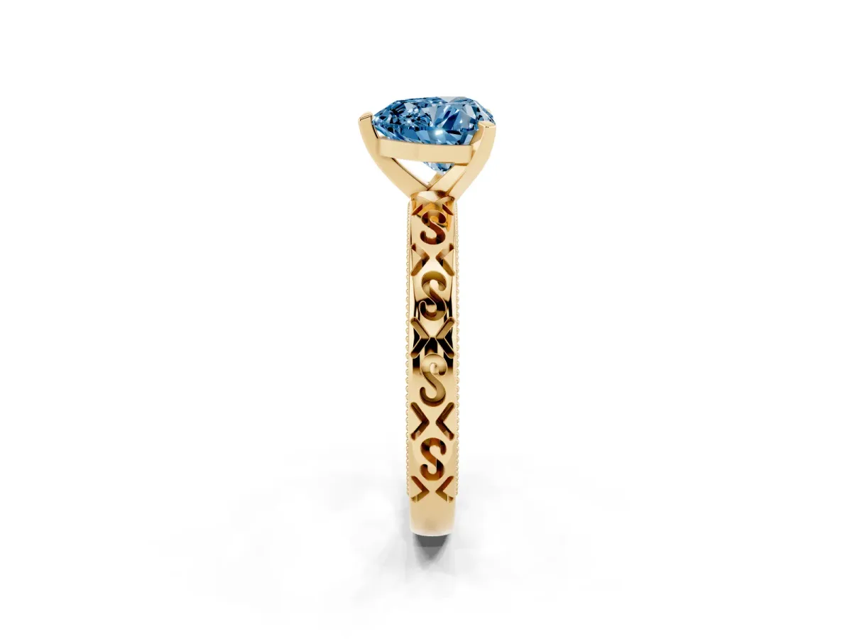Fancy Blue Heart Cut Solitaire Engagement Ring with Scrollwork Band and Four-Prong Setting Yellow gold
