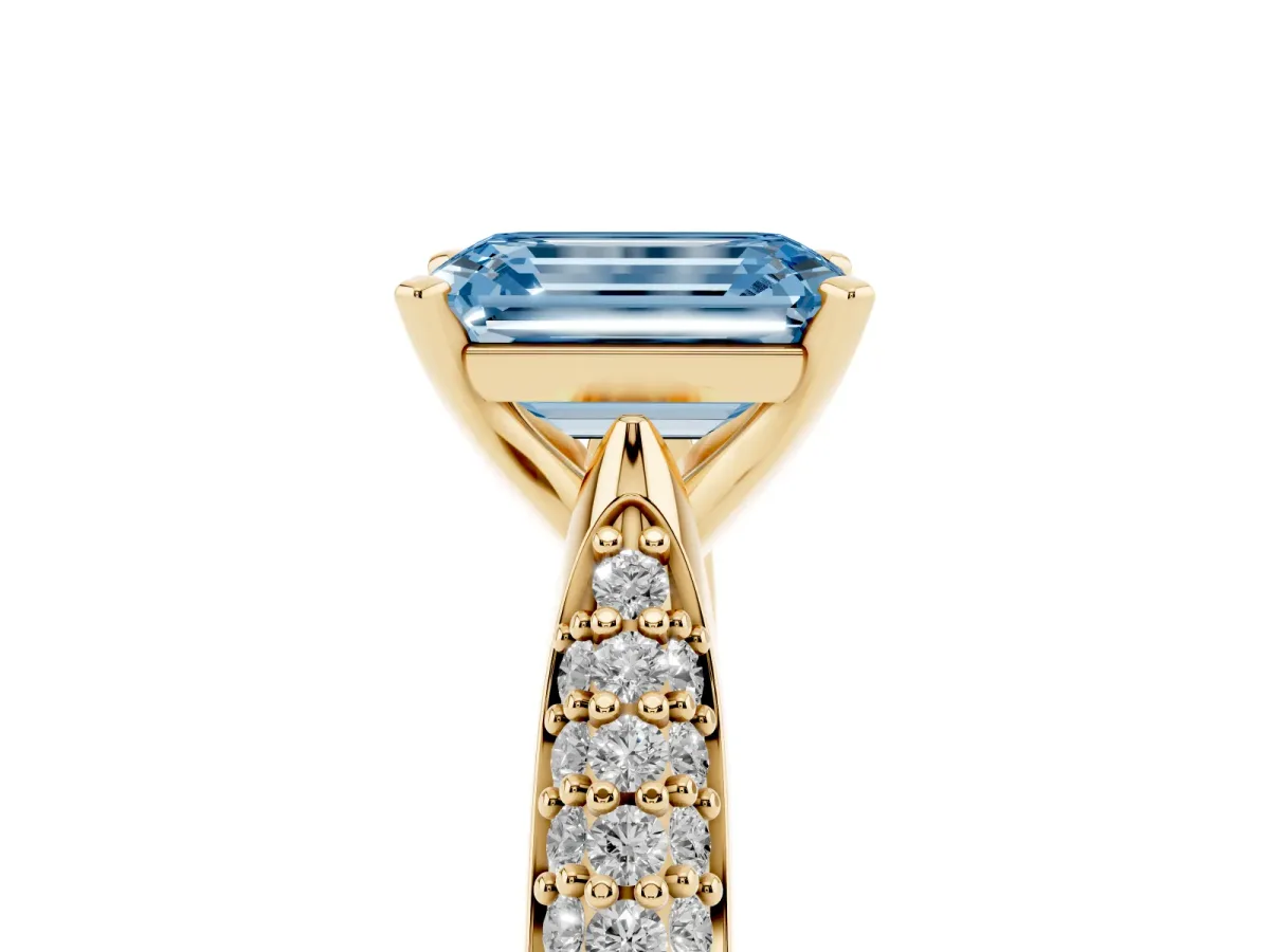 Fancy Blue Emerald Cut Diamond Solitaire Engagement Ring with Multi-Row Round Pavé Band and Prong Setting Yellow gold
