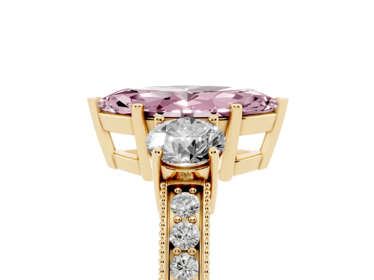 Fancy Pink Marquise Cut Three-Stone Diamond Ring with Pavé Band and Four-Prong Setting Yellow gold