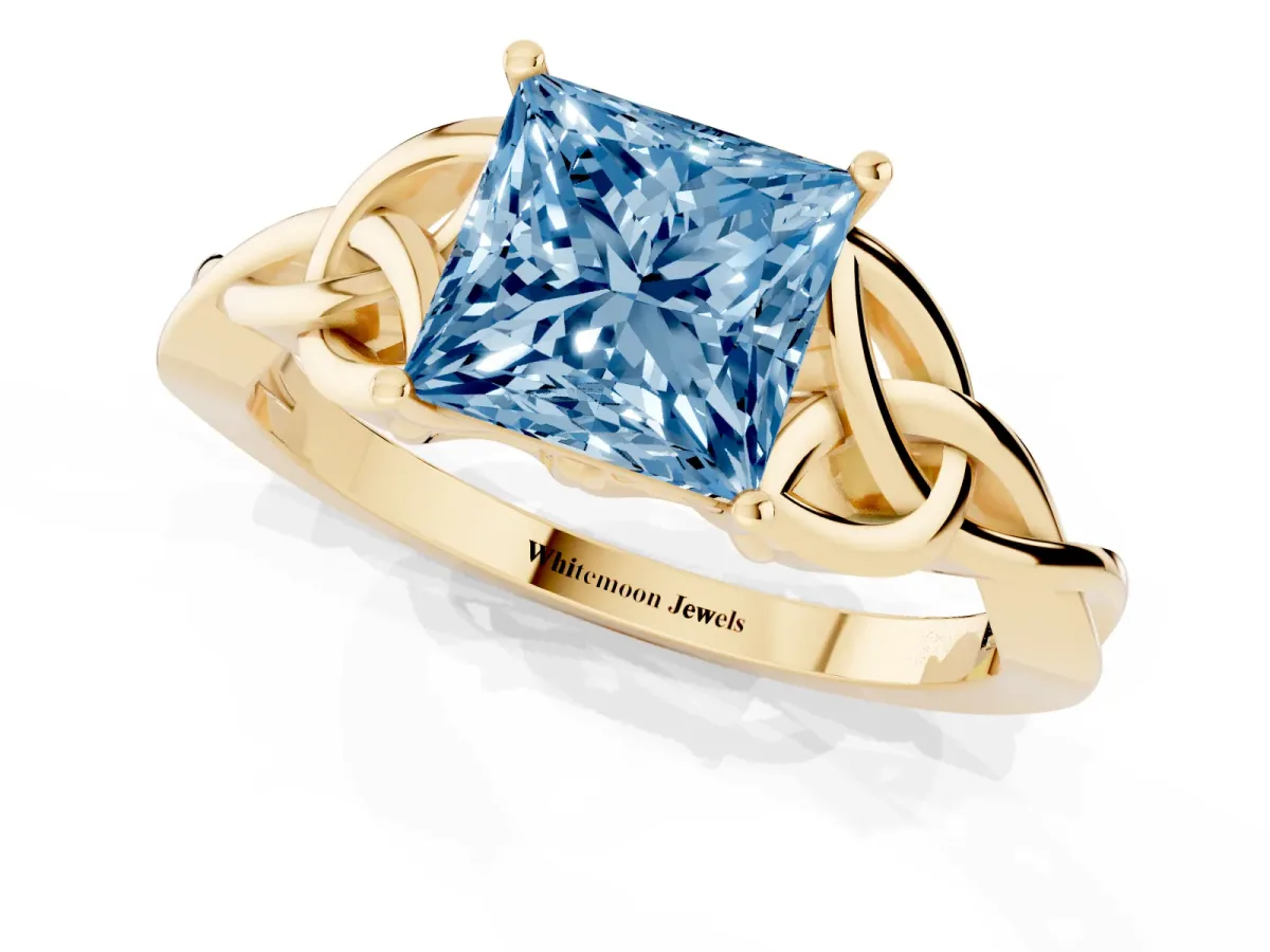 Fancy Blue Princess Cut Diamond Solitaire Engagement Ring with Celtic Knot Band and Four-Prong Setting Yellow gold
