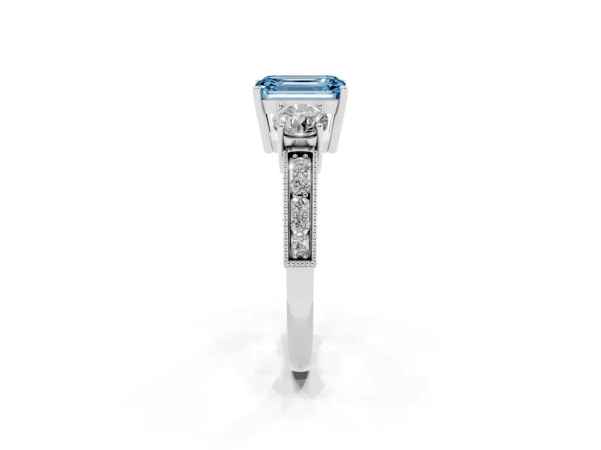Fancy Blue Emerald Cut Three-Stone Diamond Ring with Pavé Band and Four-Prong Setting Silver
