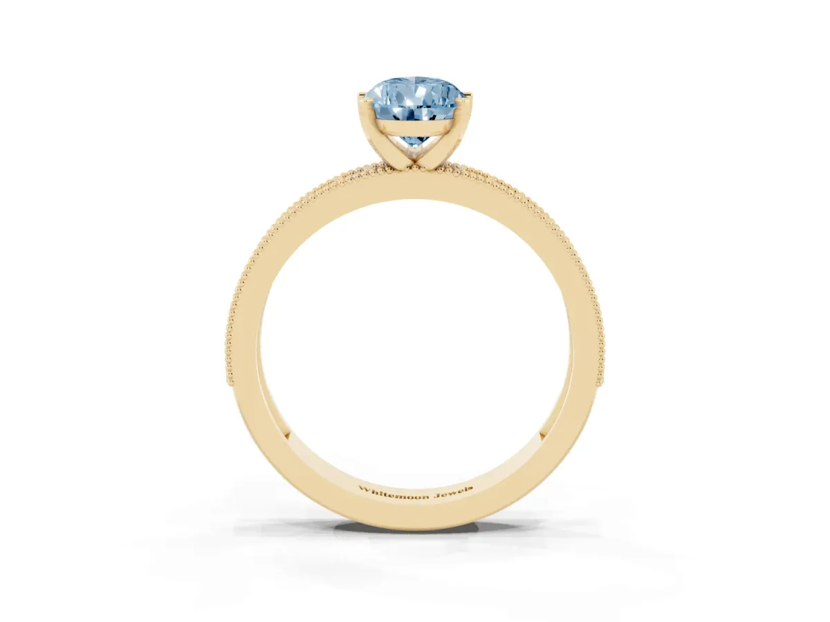 Fancy Blue Pear Cut Diamond Milgrain Pavé Engagement Ring with Four-Prong Setting Yellow gold