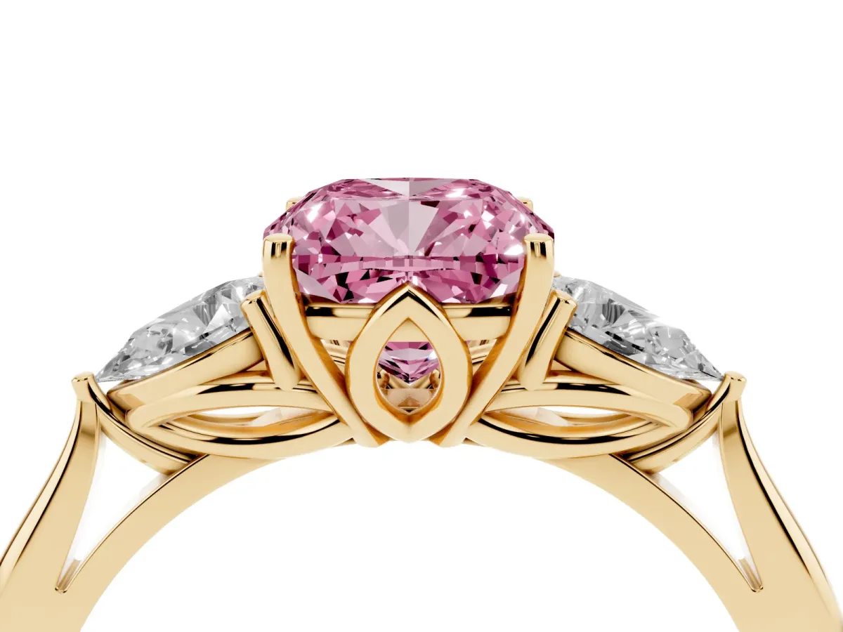 Fancy Pink Three-Stone Cushion Cut Diamond Ring with Pear Side Stones in Four-Prong Setting Yellow gold