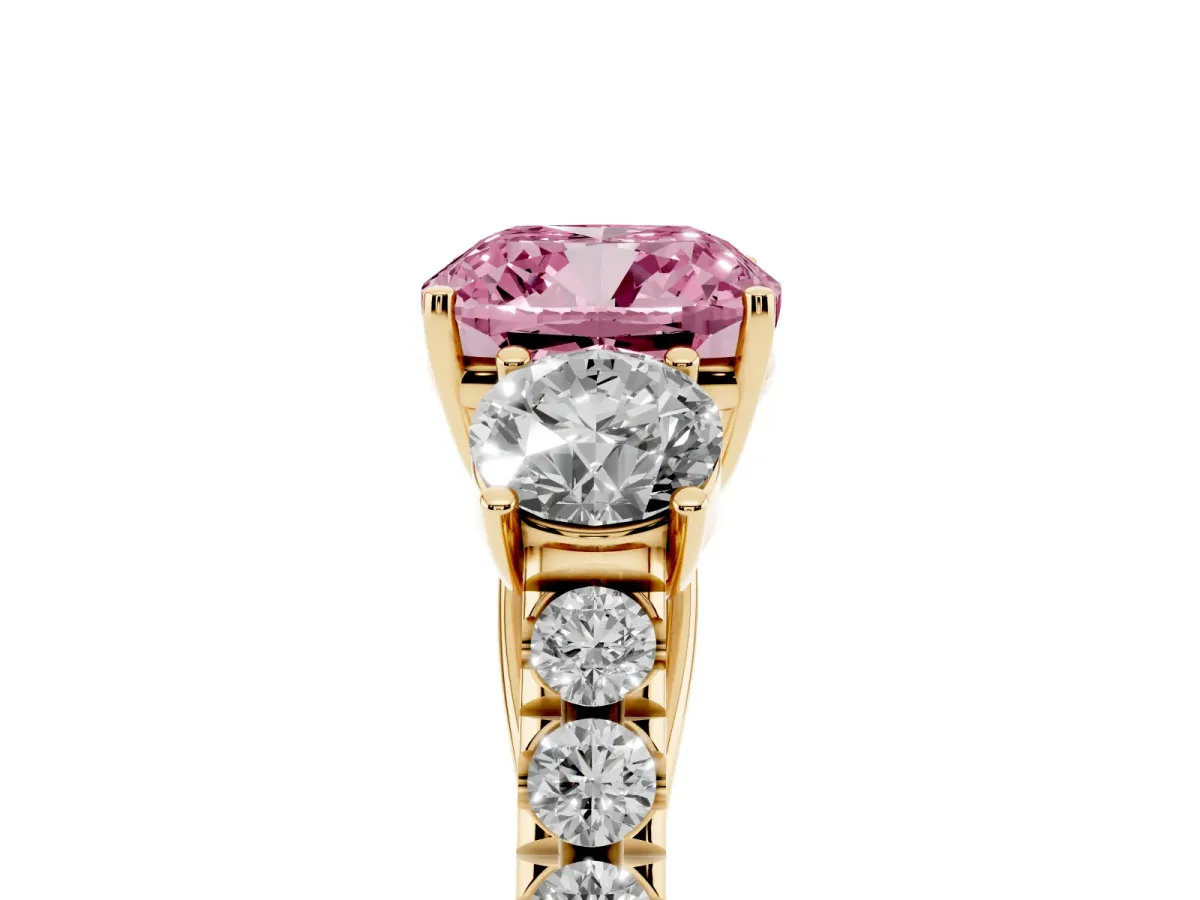 Fancy Pink Cushion Cut Cut Diamond Three-Stone Ring with Round Side Stones and Pavé Band Yellow gold