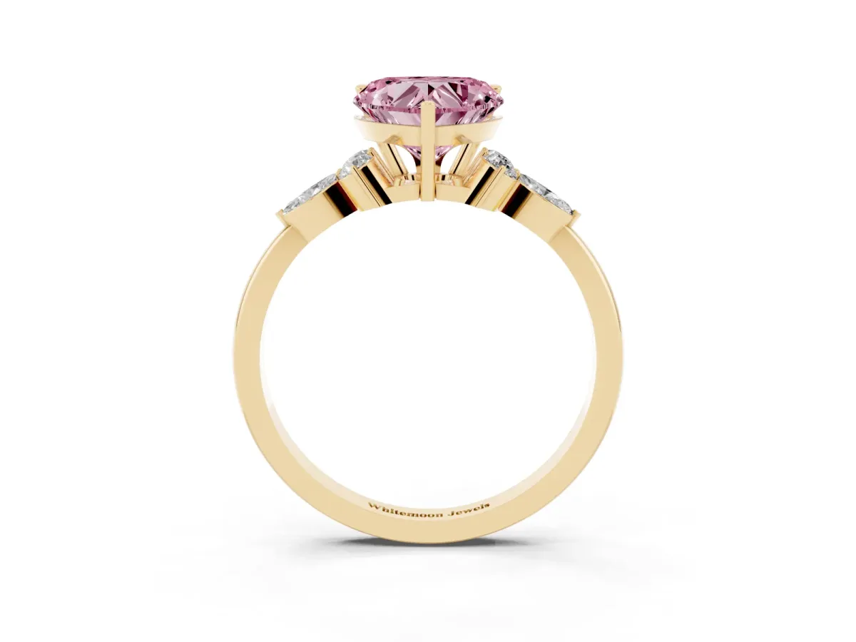 Fancy Pink Heart Cut Brilliant Diamond Solitaire Ring with Pear Side Stones and Four-Prong Setting Yellow gold
