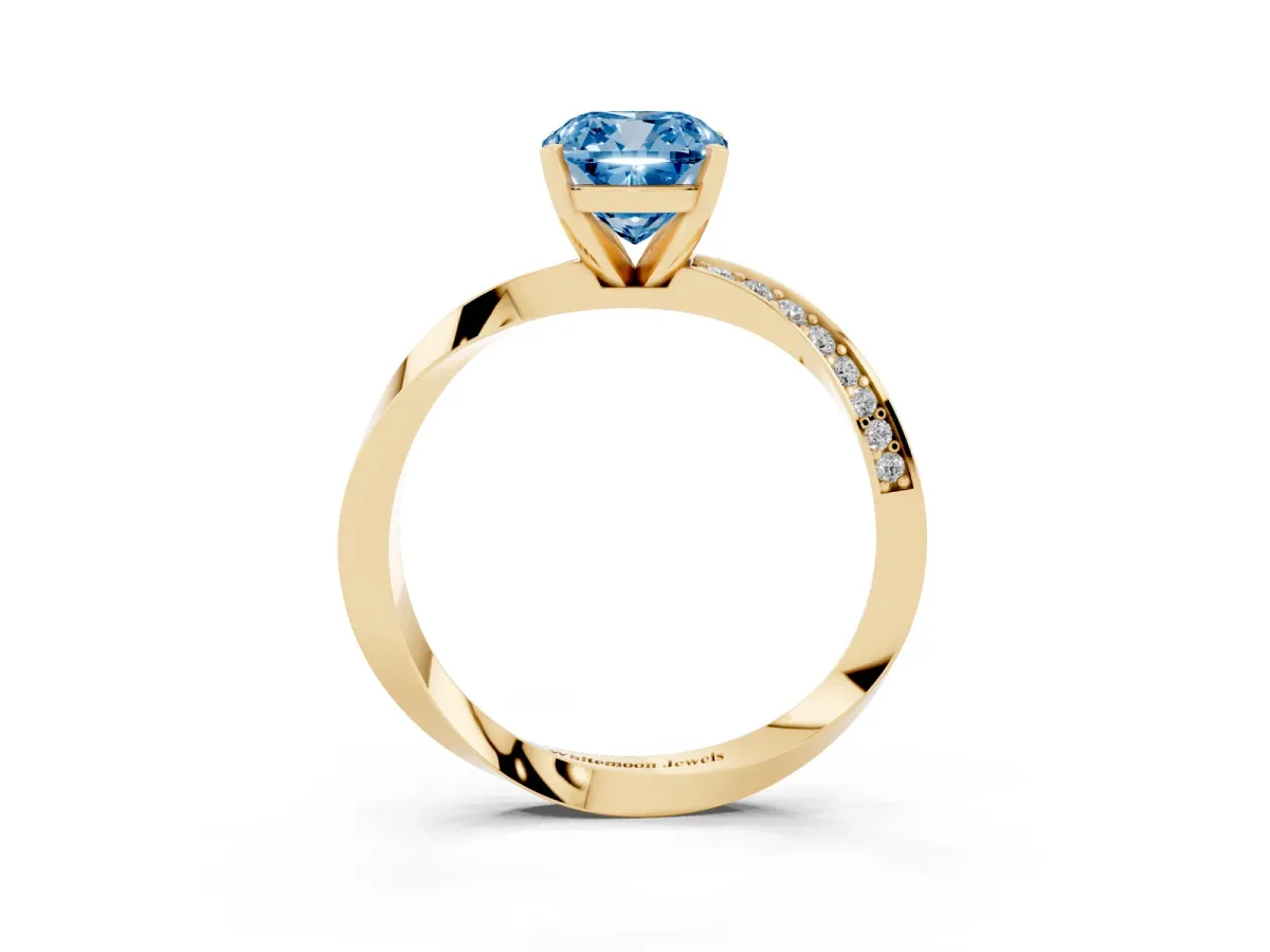 Fancy Blue Cushion Cut Diamond Engagement Ring with Side Stone Accents and Four-Prong Setting Yellow gold