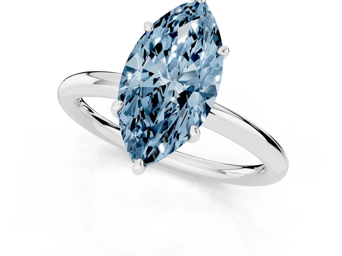 Fancy Blue Oval Cut Solitaire Diamond Ring with Four-Prong Setting on a Plain Band Platinum