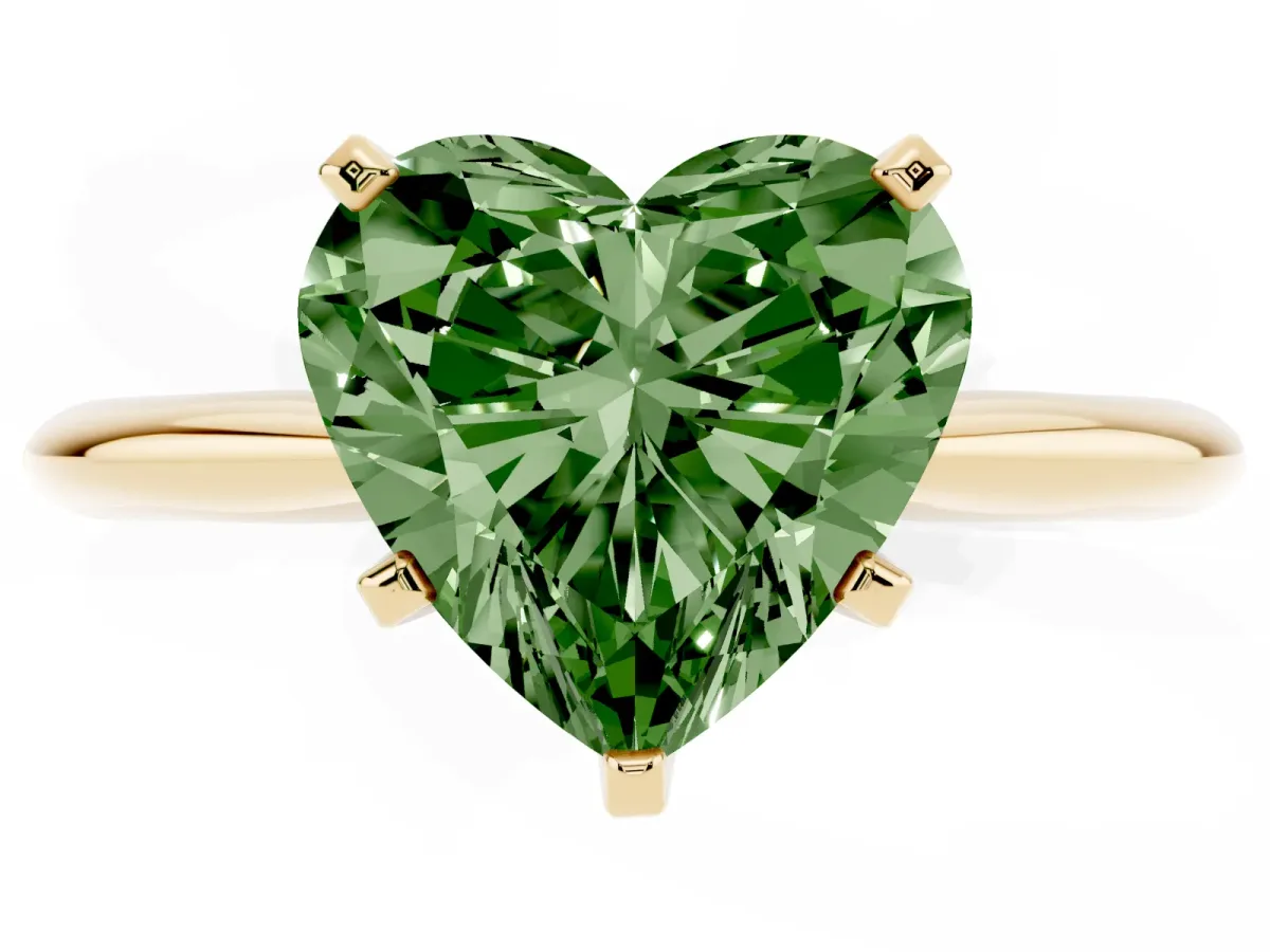 Fancy Green Heart Cut Cut Solitaire Ring with Four-Prong Setting on a Classic Band Yellow gold