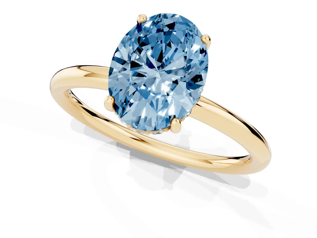 Fancy Blue Oval Cut Solitaire Diamond Ring with a Classic Band and Four-Prong Setting Yellow gold