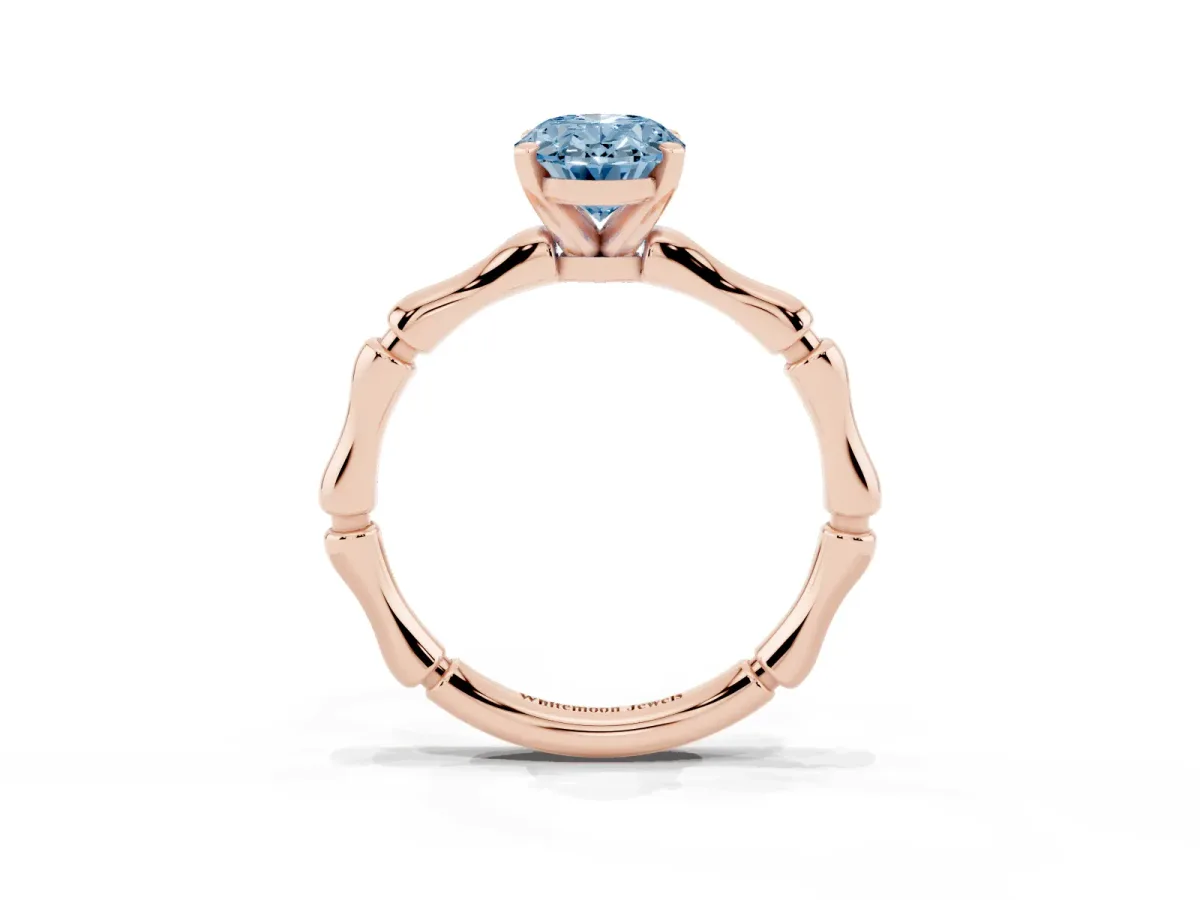 Fancy Blue Oval Cut Solitaire Diamond Ring with Bamboo Band and Four-Prong Setting Rose gold