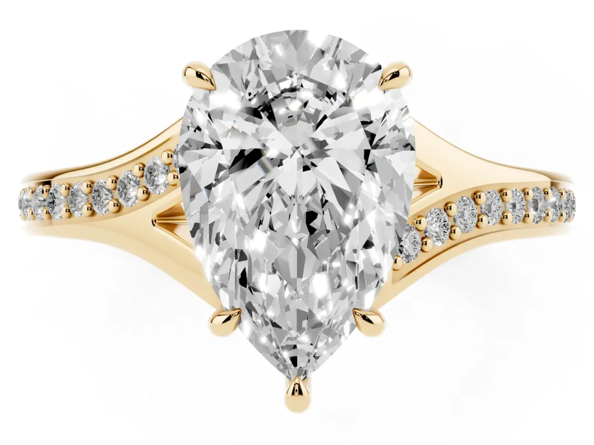 Pear Cut Diamond Solitaire Ring with Pavé Band and Prong Setting Yellow gold
