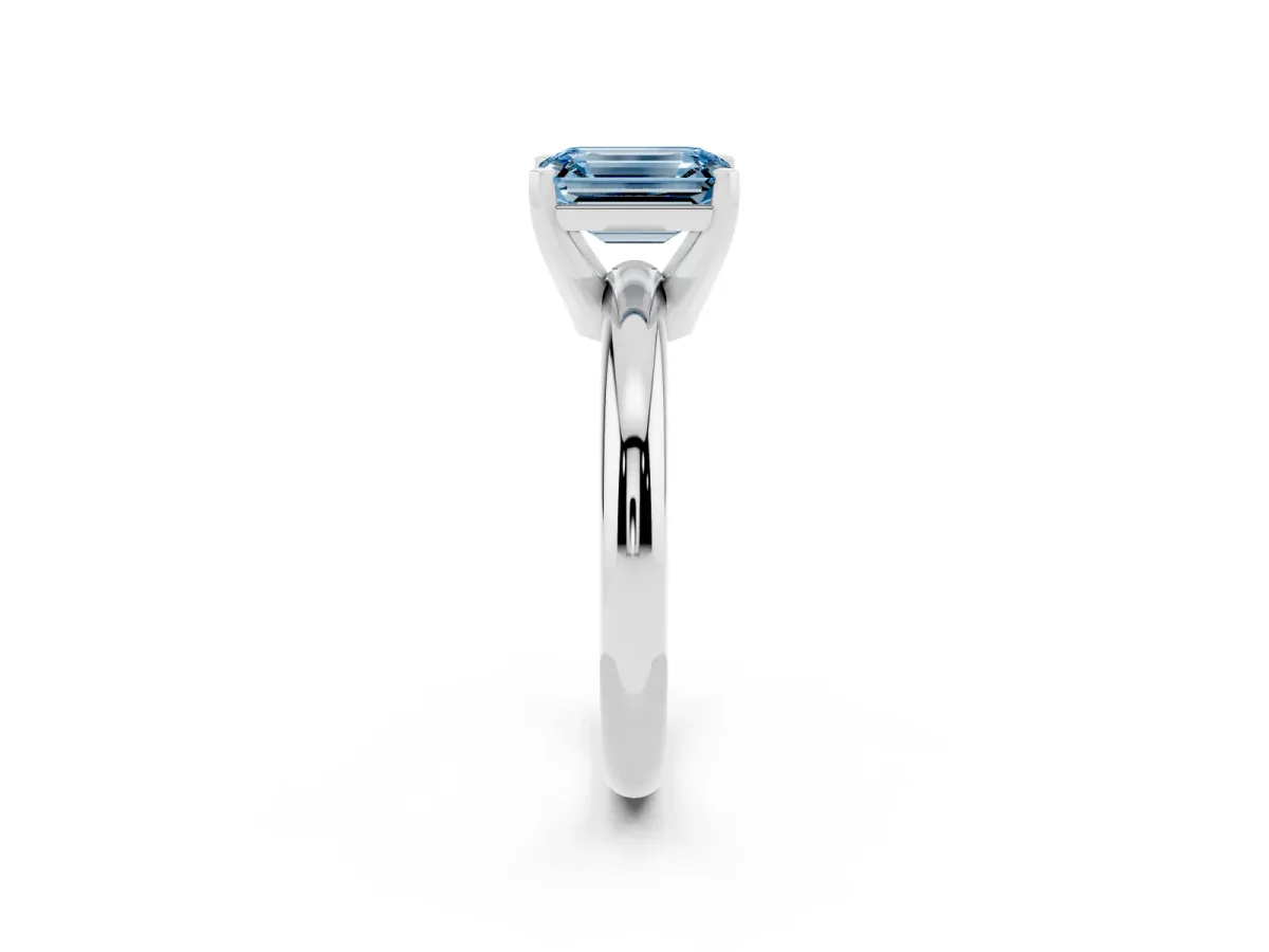 Fancy Blue Emerald Cut Diamond Solitaire Engagement Ring with Round Band and Four-Prong Setting Silver
