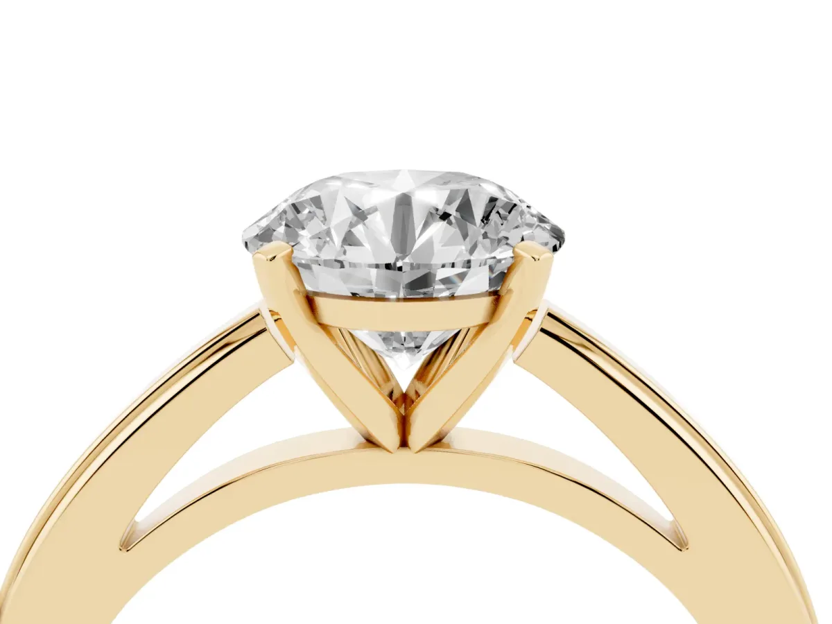 Round Cut Solitaire Diamond Ring with Four-Prong Setting and Classic Band Yellow gold