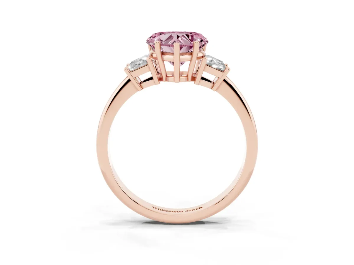 Fancy Pink Heart Cut Diamond Three-Stone Ring with Trapezoid Side Stones and Prong Setting Rose gold