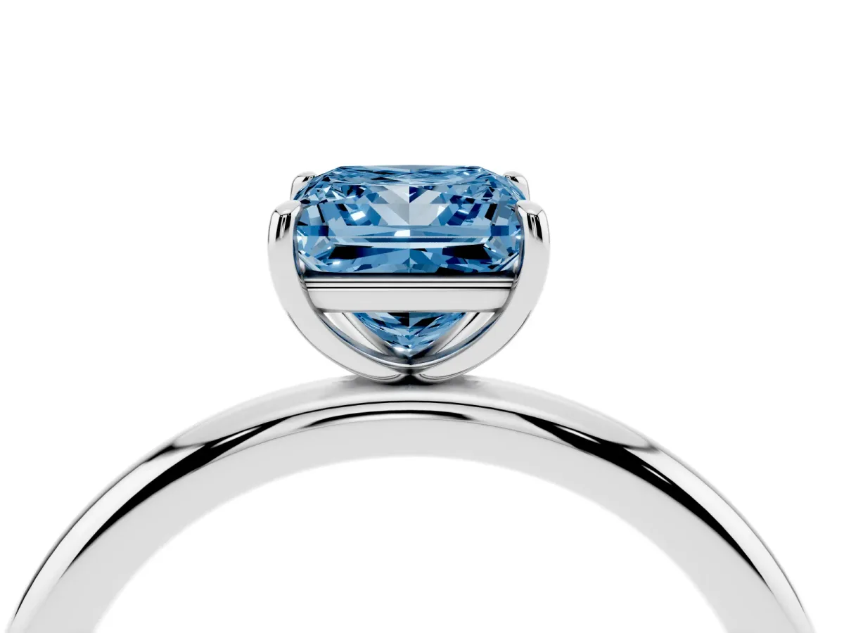 Fancy Blue Princess Cut Solitaire Diamond Ring with Four-Prong Setting on a Plain Band Platinum