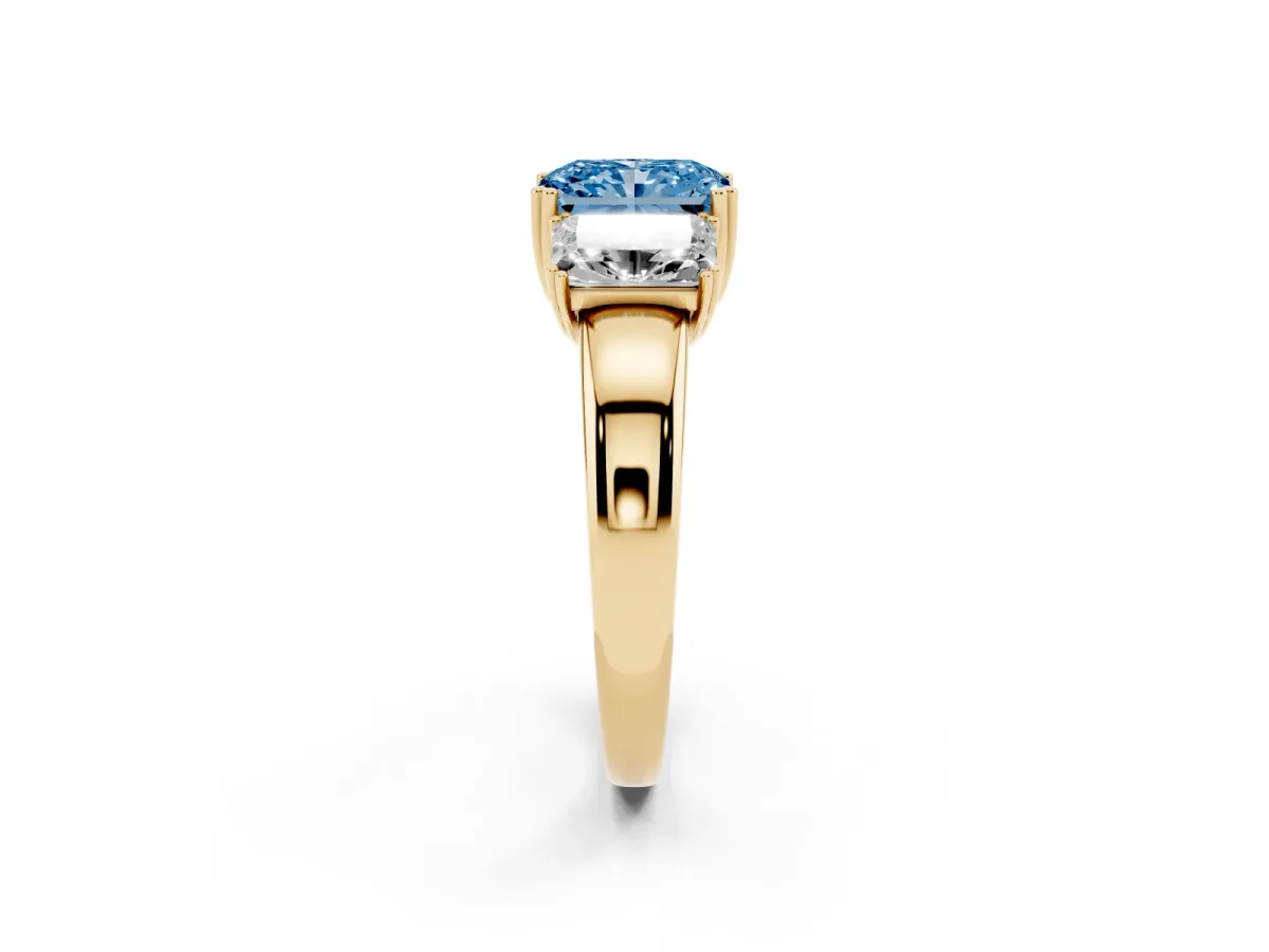 Fancy Blue Three-Stone Radiant Cut Cut Diamond Ring with Channel Set Band and Four-Prong Setting Yellow gold