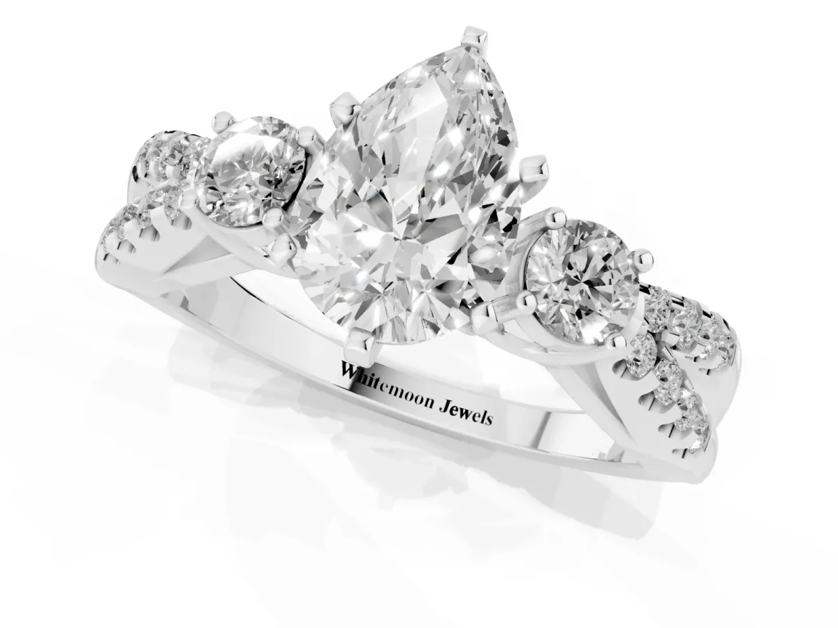 Pear Cut Diamond Three-Stone Ring with Pavé Split Shank and Four-Prong Setting Platinum