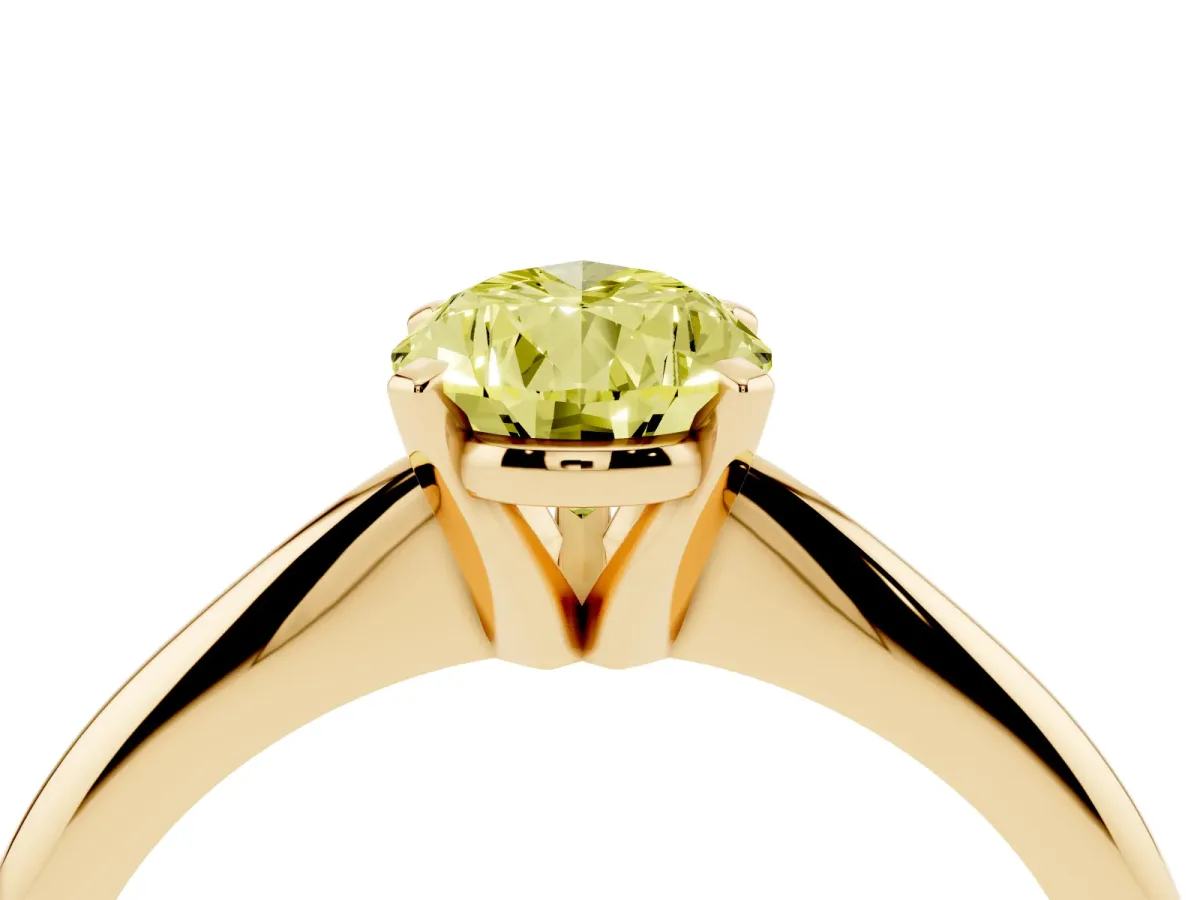 Fancy Yellow Pear Cut Cut Solitaire Ring with Four-Prong Setting on a Classic Band Yellow gold
